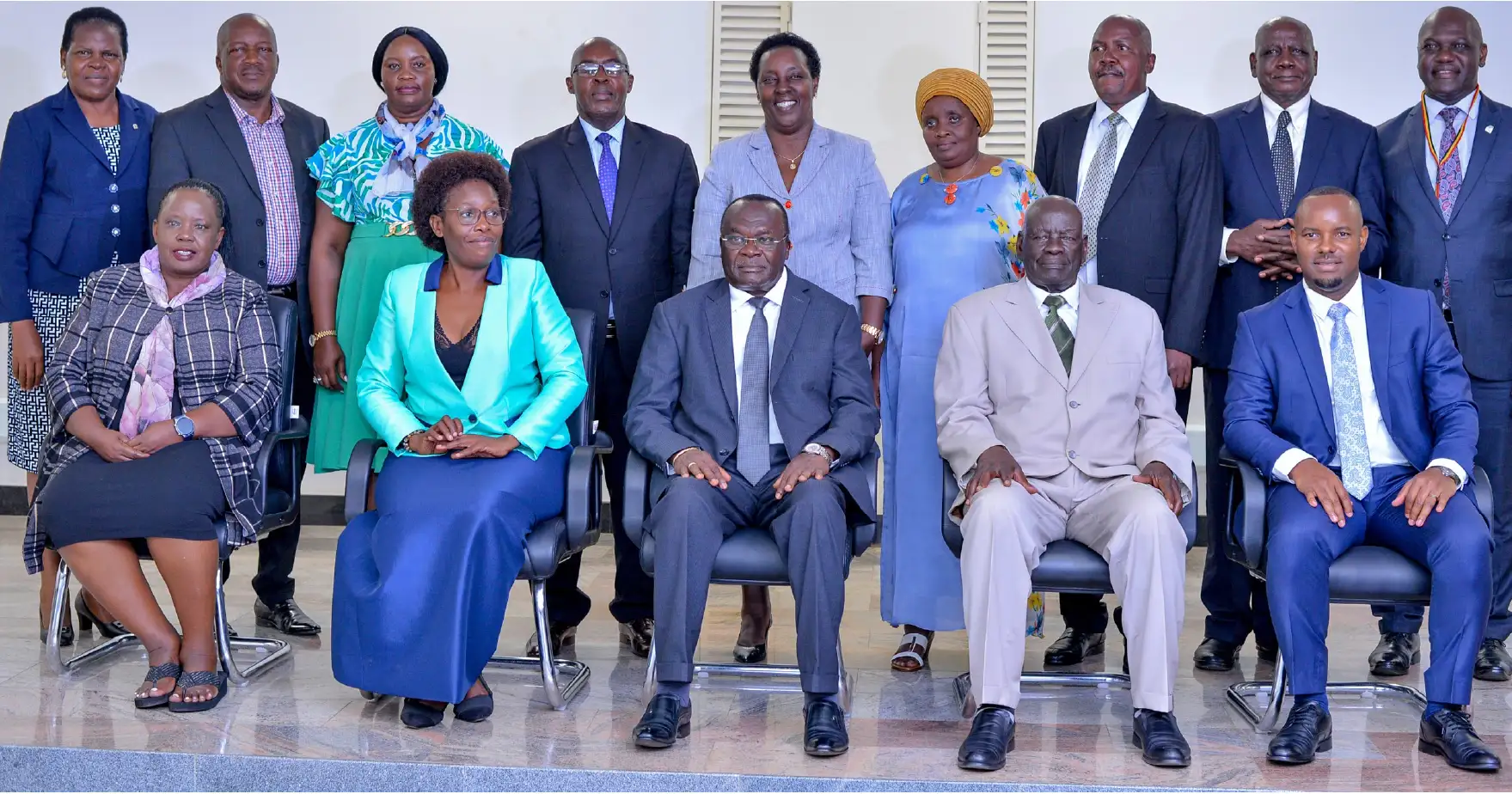 Chief Justice of Uganda (center) with the Hon. Minister of Lands, Permanent Secretary, Chairperson, Commissioners and Secretary to the Commission.